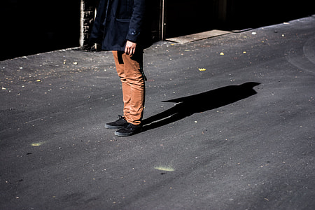 person standing on road during daytime thumbnail