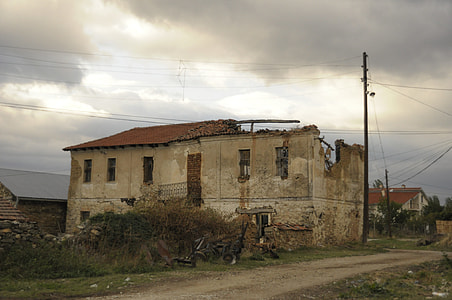 gray concrete 2-storey house beside black post thumbnail