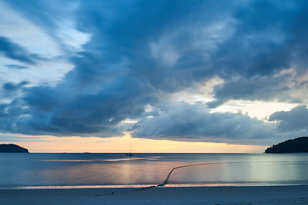 calm body of water under cumulus clouds thumbnail