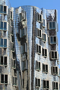 silver concrete building with windows opened thumbnail