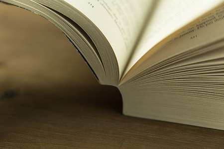 Closeup shot of an open book on a table thumbnail