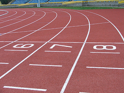 maroon race track under blue sky thumbnail