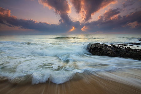 timelapse photo of shoreline during golden hour thumbnail