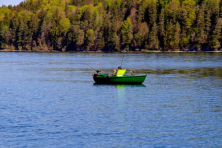 person riding on boat on body of water thumbnail