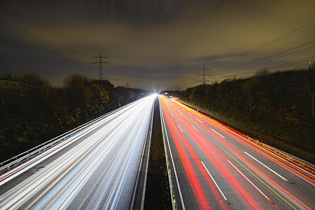 photo of lighted cars on street during nighttime thumbnail