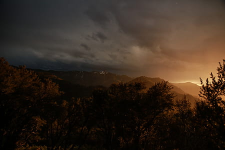 mountain range under cloudy sky thumbnail
