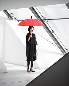 woman holding red umbrella thumbnail