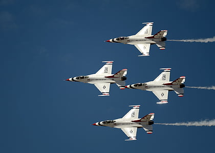four white fighting planes flying on sky at daytime thumbnail