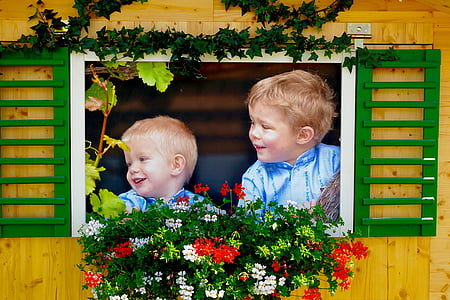 two boys looking outside window thumbnail