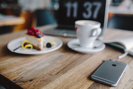 Working in a restaurant: Macbook, Cheese Cake and Cup of Coffee thumbnail