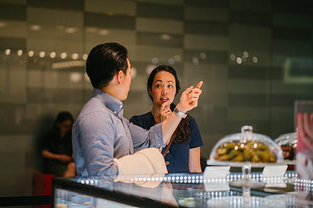 Man Standing in Front of Woman thumbnail