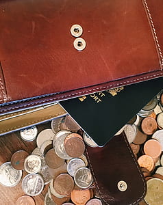 assorted coin collection on top of table thumbnail