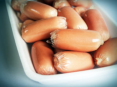 brown sausages in white bowl thumbnail
