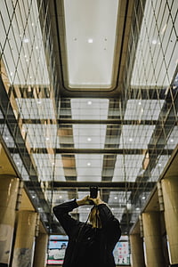 man using camera taking photo of building thumbnail