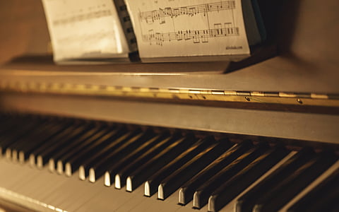 close up of gray and white upright piano thumbnail