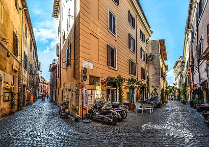 motorcycles near building and road photo thumbnail