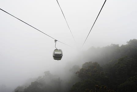 aerial photography of cable car during foggy daytime thumbnail
