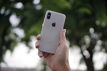 person holding silver iPhone X thumbnail
