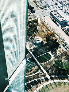 aerial view of tall glass building during daytime thumbnail