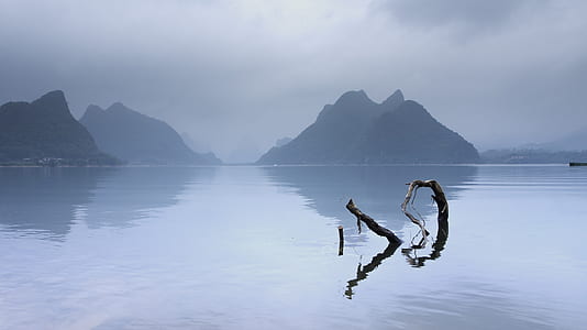photo of a body of water and mountain thumbnail