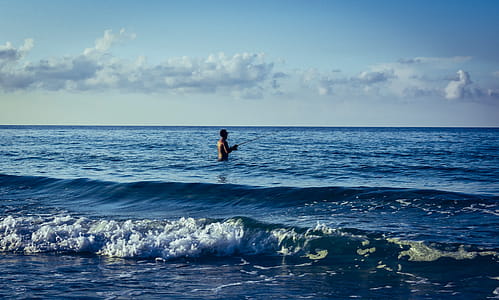 Man Fishing on Body of Water thumbnail