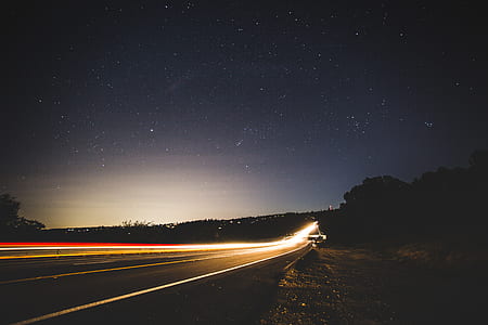 timelapse photography of road at night time thumbnail