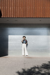woman standing near building during daytime thumbnail