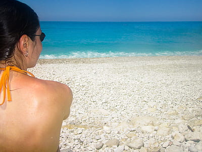 woman sitting on white sand thumbnail