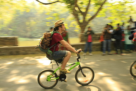 man riding bicycle at daytime thumbnail