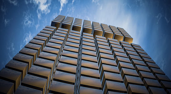 low angle photography of high-rise building under blue sky thumbnail