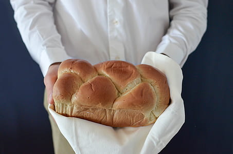person holding leavened bread thumbnail