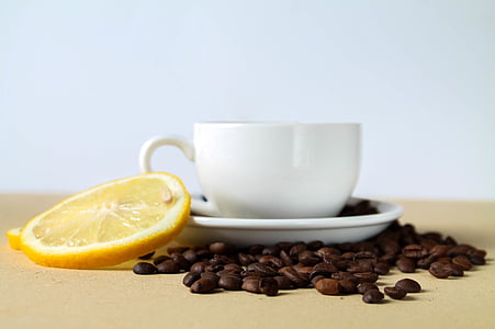 white ceramic teacup near white surfcae thumbnail