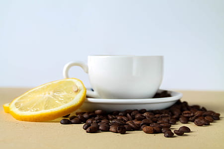 white ceramic cup beside sliced lime thumbnail