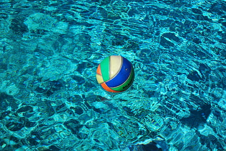 photo of volleyball floating on body of water thumbnail
