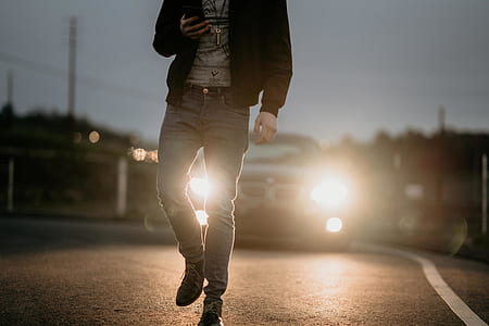 person holding smartphone while walking thumbnail