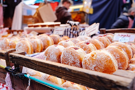 doughnuts on brown wooden tray thumbnail