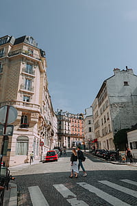 female and male walking on streets beside pedestrian lane thumbnail
