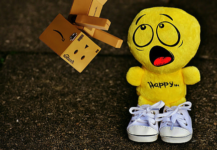 yellow character plush toy wearing pair of white low-top sneakers thumbnail
