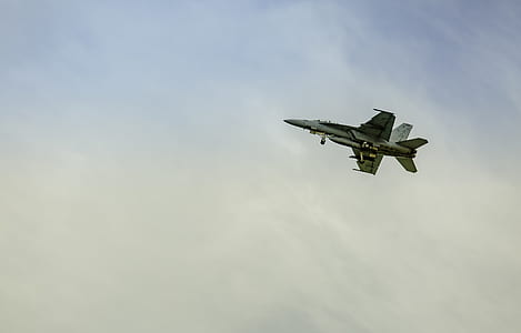 fighter jet flying above clouds thumbnail