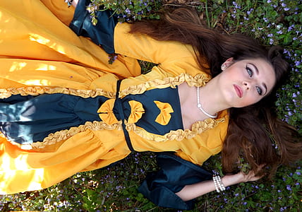 woman wearing black and yellow long-sleeved dress thumbnail