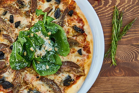 pizza served on white plate thumbnail