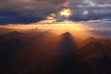 mountains under clouds at daytime thumbnail