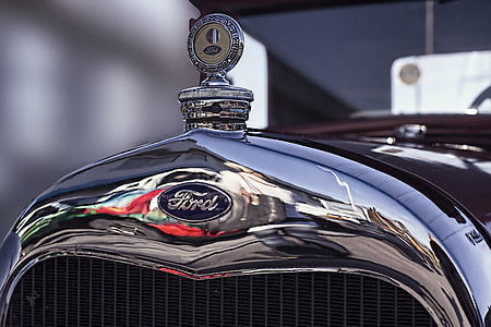 close-up photography of blue Ford vehicle thumbnail