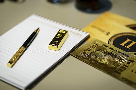 two gold pen and bar on notebook thumbnail