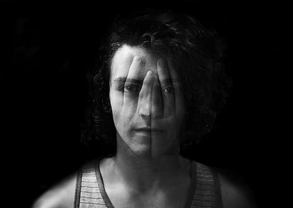 grayscale photograph of man wearing tank top thumbnail