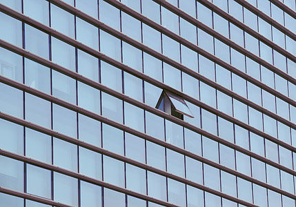 blue building windows during daytime thumbnail