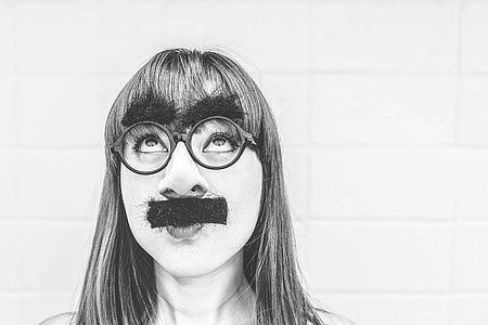gray scale photo of woman wearing eyeglasses and mustache thumbnail