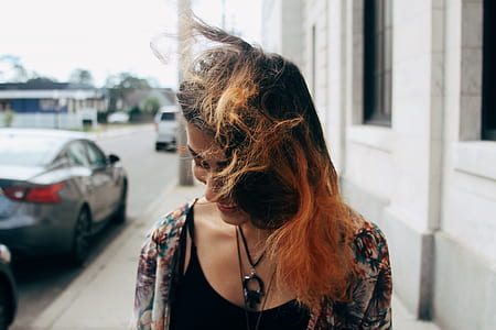 woman standing on sidewalk thumbnail