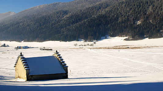 beige cabin near mountain at daytime thumbnail