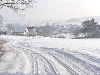 snow field near houses thumbnail